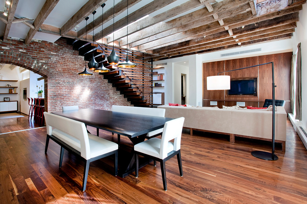 Inspiration for an industrial open plan dining in New York with dark hardwood floors, white walls and no fireplace.