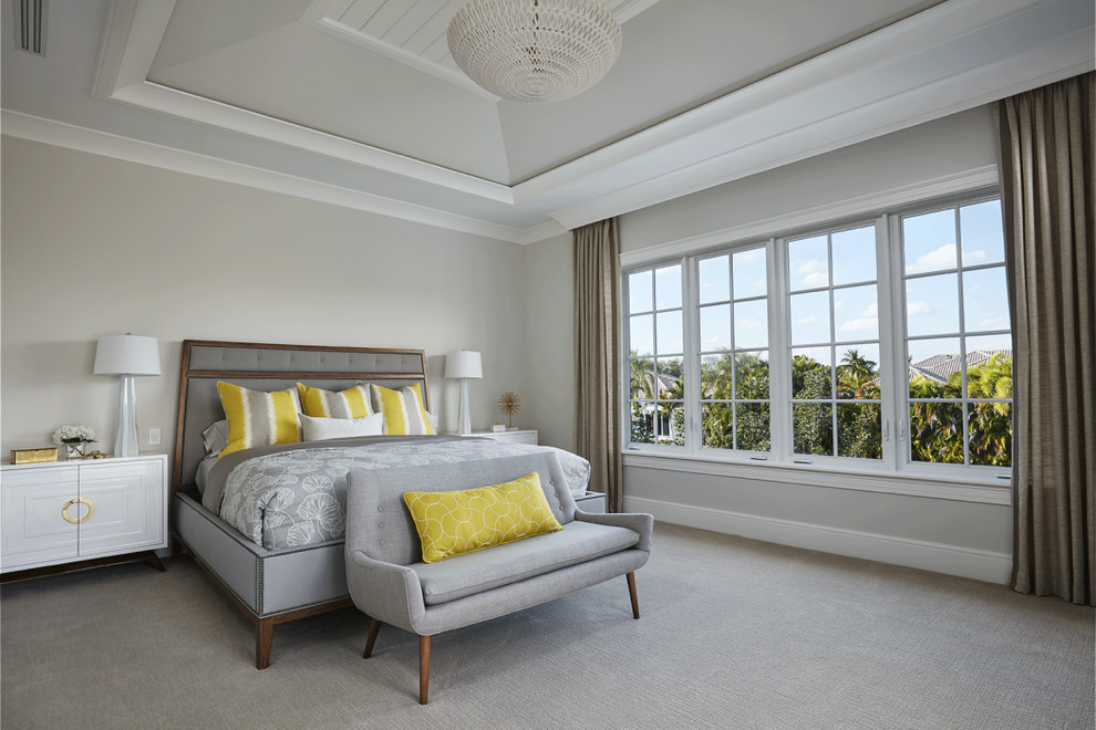 Example of a transitional carpeted bedroom design in Miami with gray walls