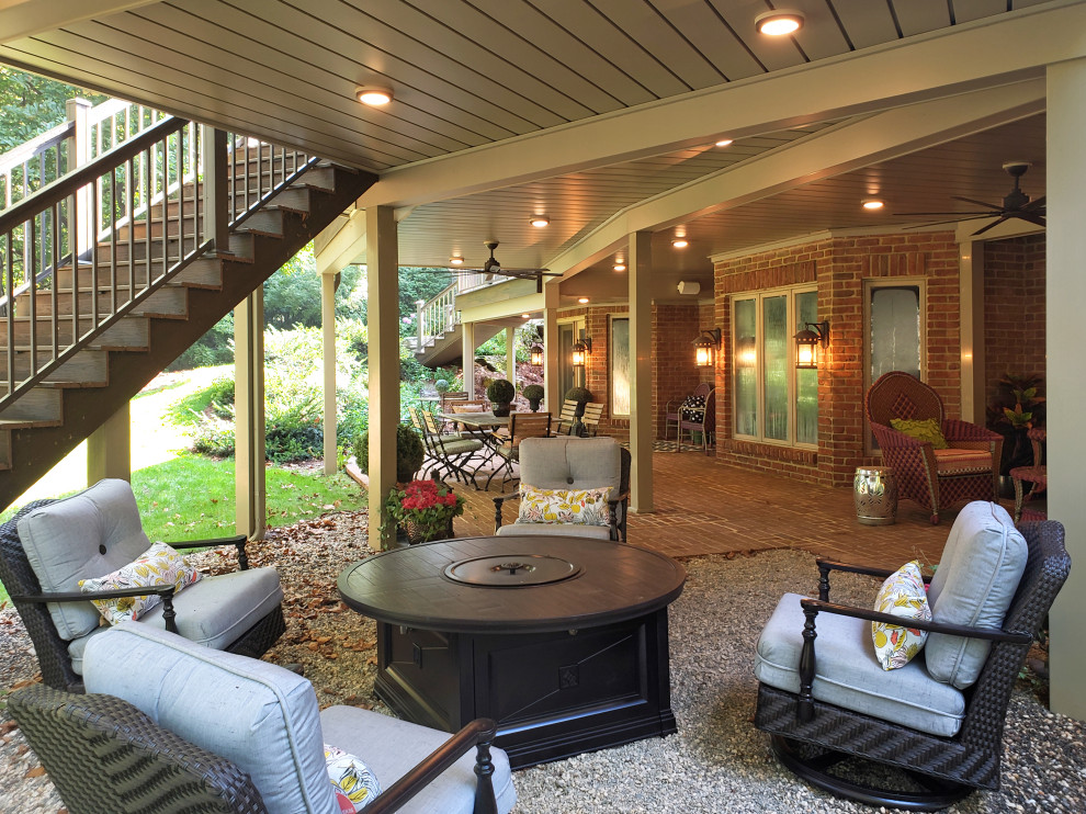 Example of a transitional backyard second story metal railing deck design
