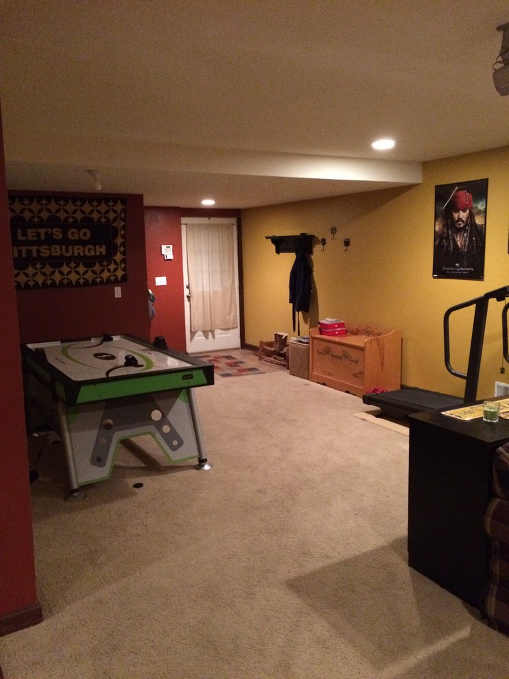 Basement - mid-sized traditional walk-out carpeted and beige floor basement idea with red walls