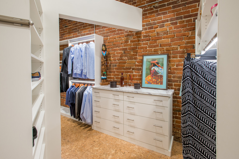 This is an example of a transitional dressing room in Denver with flat-panel cabinets and white cabinets.
