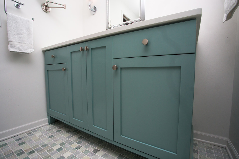 Inspiration for a mid-sized contemporary master bathroom in New York with shaker cabinets, turquoise cabinets, a freestanding tub, a corner shower, a two-piece toilet, green tile, subway tile, white walls, marble floors, an undermount sink and engineered quartz benchtops.