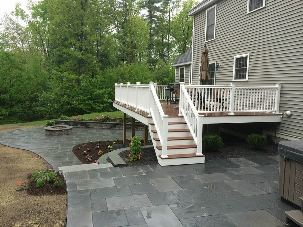Photo of a mid-sized traditional backyard deck in Boston with a fire feature and no cover.