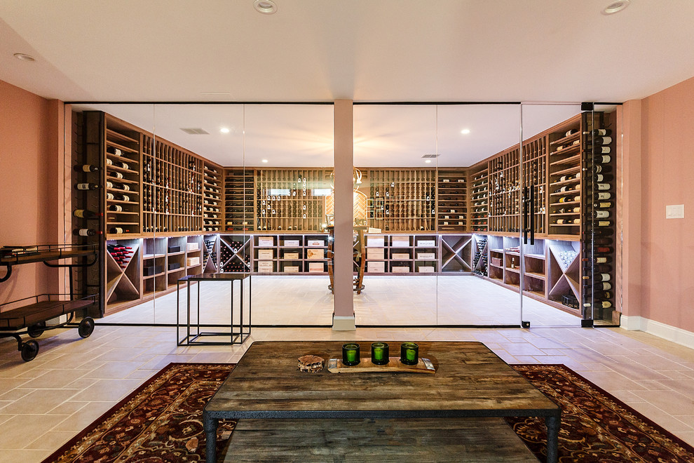 Photo of a large transitional wine cellar in Philadelphia with porcelain floors, display racks and beige floor.