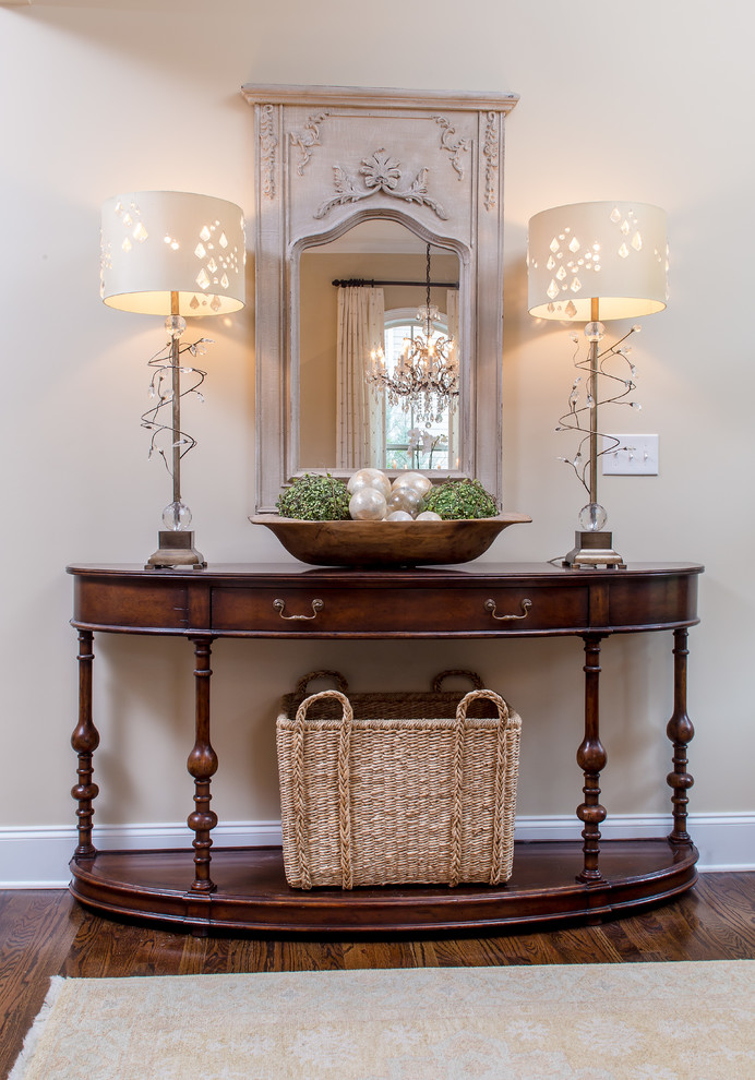 This is an example of a mid-sized transitional foyer in Atlanta with beige walls, dark hardwood floors, a double front door, a dark wood front door and brown floor.
