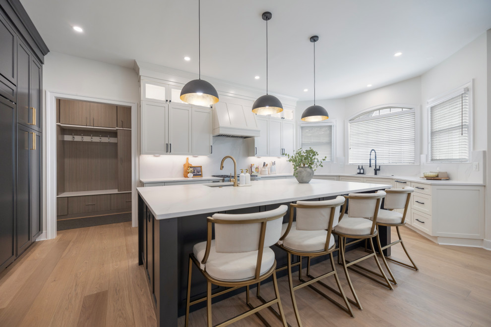 Example of a large transitional u-shaped eat-in kitchen design in DC Metro