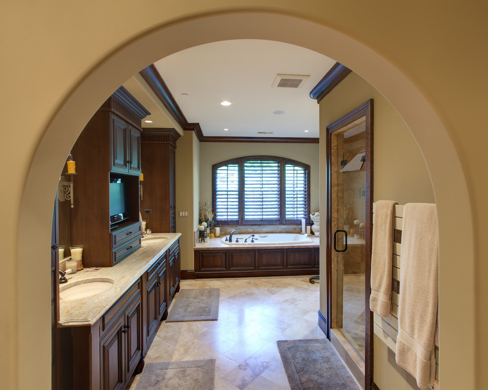 Inspiration for an expansive master bathroom in DC Metro with brown cabinets and marble benchtops.
