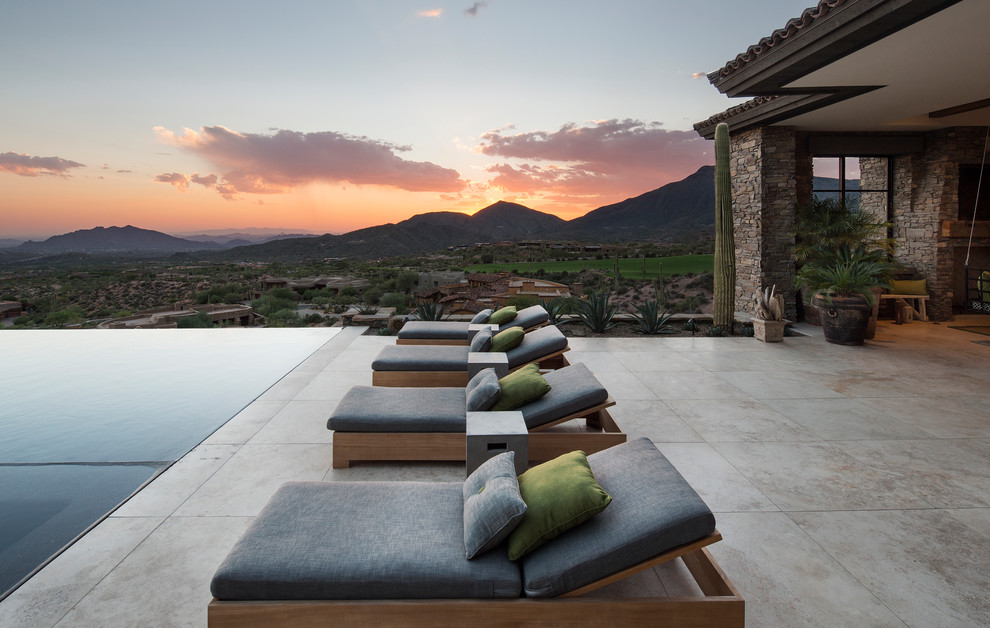 Inspiration for a southwestern backyard patio remodel in Phoenix with no cover