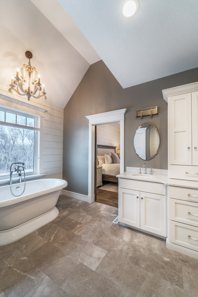 Large traditional master bathroom in Other with recessed-panel cabinets, white cabinets, a freestanding tub, a double shower, a two-piece toilet, white tile, marble, grey walls, marble floors, an undermount sink, engineered quartz benchtops, grey floor and an open shower.