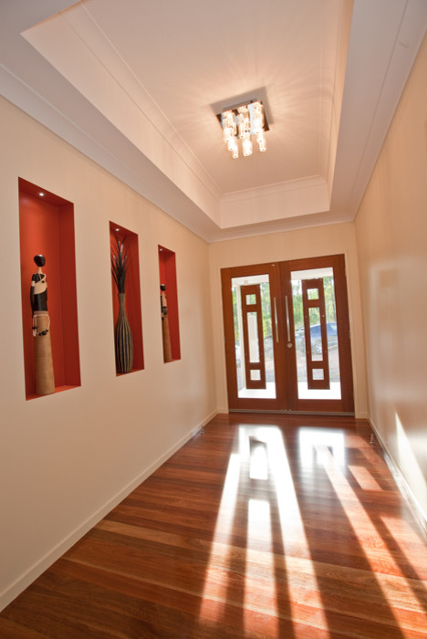 Mid-sized contemporary front door in Brisbane with medium hardwood floors, a double front door, a dark wood front door and beige walls.
