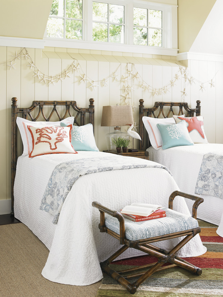 Mid-sized beach style guest medium tone wood floor bedroom photo in Orange County with yellow walls