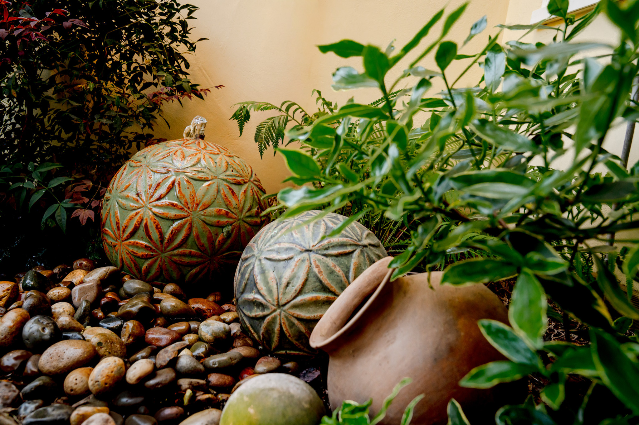 Porcelain Fountain Spheres with Clay Vessel and River Rocks