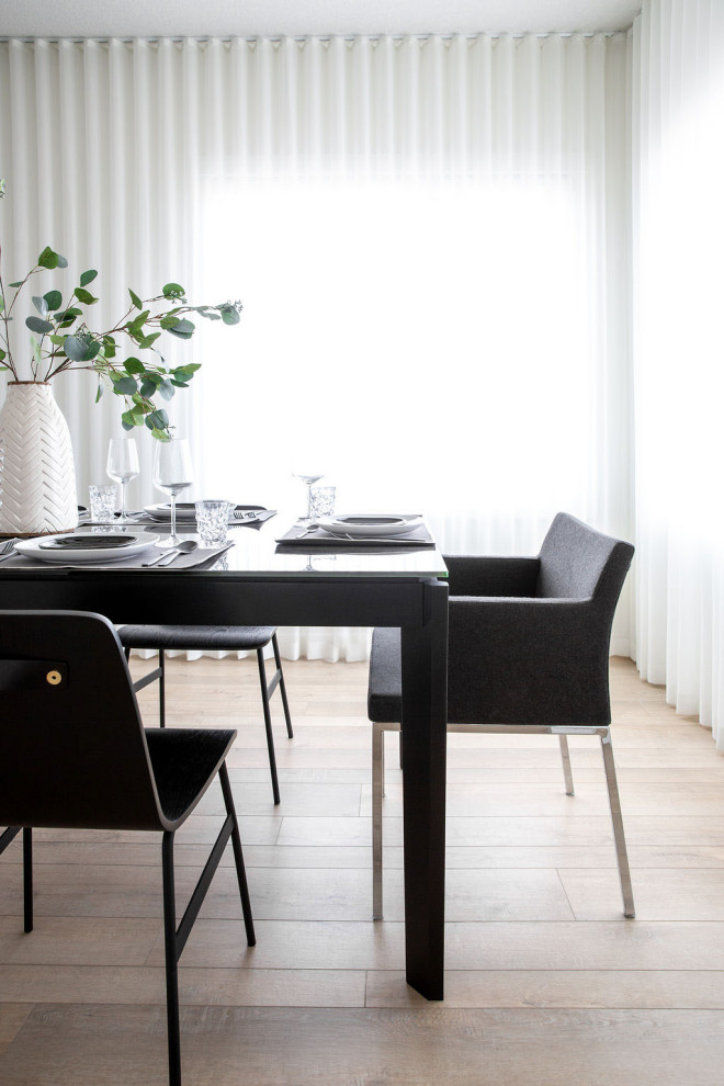 Mid-sized trendy medium tone wood floor and beige floor kitchen/dining room combo photo in Vancouver with white walls