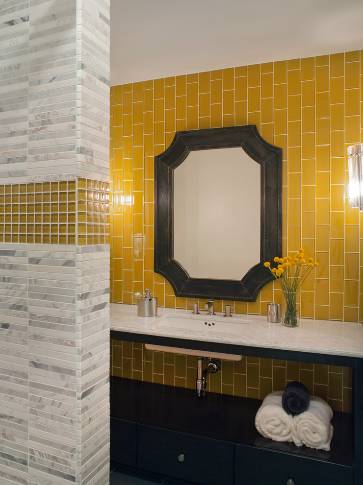 Inspiration for a contemporary bathroom in San Francisco with marble benchtops, mosaic tile, yellow walls, yellow tile, black cabinets and an undermount sink.