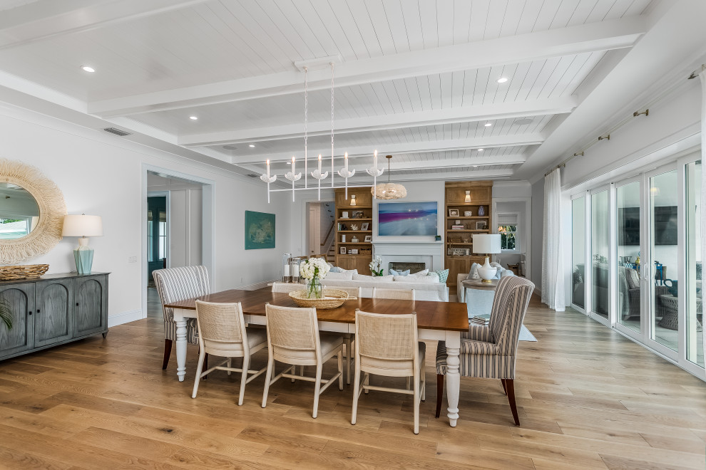 Design ideas for a large beach style dining room in Miami.