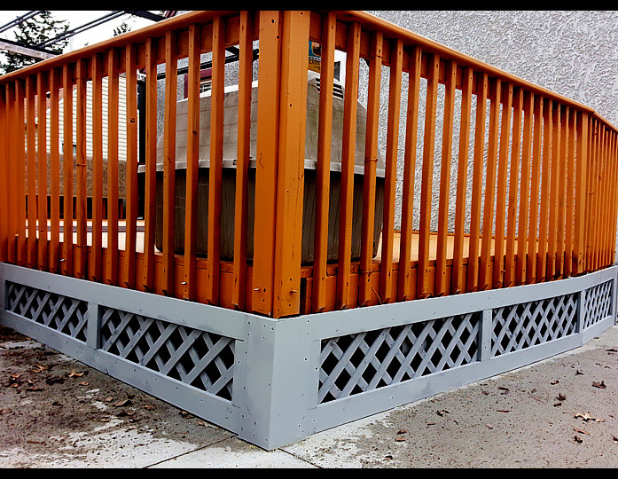 Example of a backyard deck design with a pergola