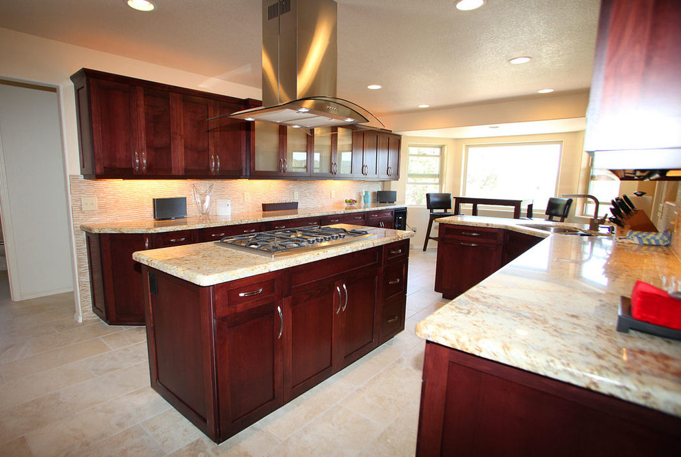 Eat-in kitchen - large transitional l-shaped eat-in kitchen idea in Phoenix with shaker cabinets, dark wood cabinets, granite countertops, beige backsplash, glass tile backsplash, stainless steel appliances, an island and a double-bowl sink