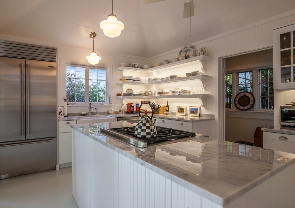 Inspiration for a mid-sized country eat-in kitchen in Miami with a farmhouse sink, shaker cabinets, white cabinets, marble benchtops, white splashback, stainless steel appliances, painted wood floors and with island.