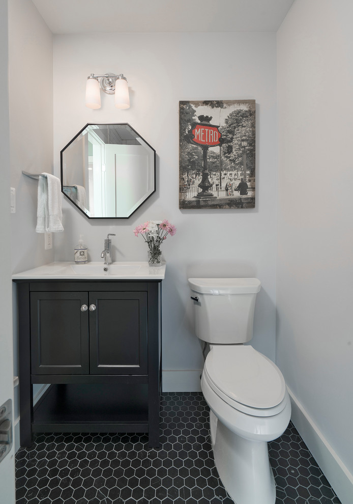 Design ideas for a mid-sized transitional 3/4 bathroom in DC Metro with a one-piece toilet, white walls, ceramic floors, an integrated sink, engineered quartz benchtops, black floor, white benchtops, furniture-like cabinets, grey cabinets, an alcove tub and subway tile.