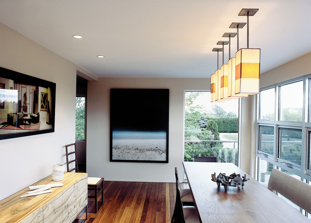 Enclosed kitchen - mid-sized modern galley medium tone wood floor enclosed kitchen idea in New York with an undermount sink, shaker cabinets, medium tone wood cabinets, stainless steel appliances and no island