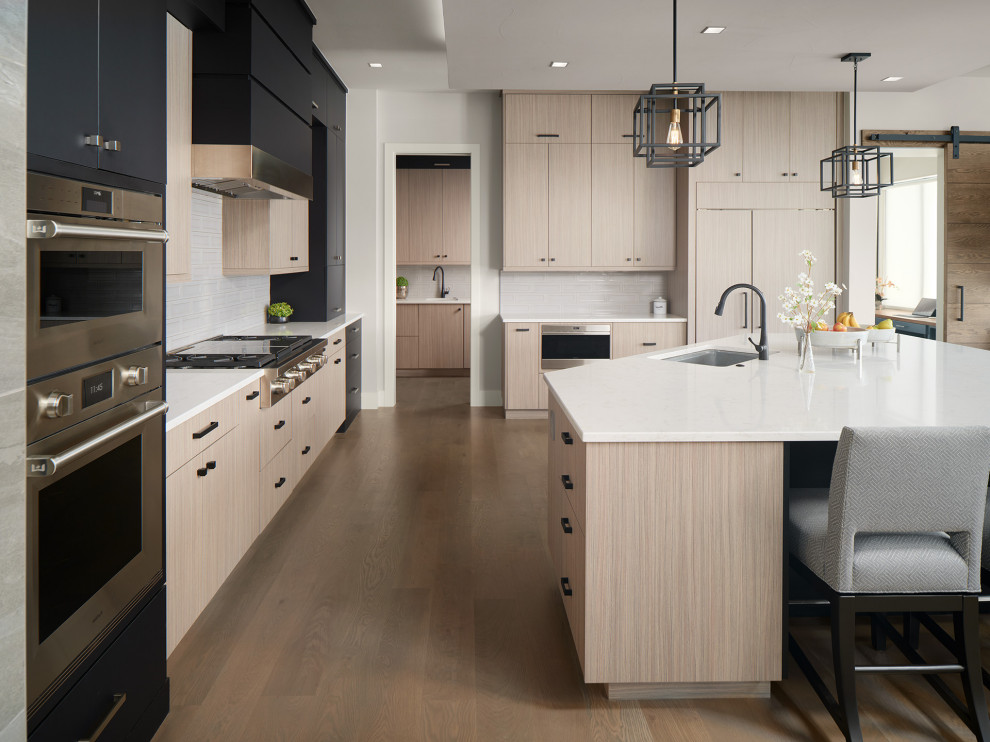 Example of a transitional kitchen design in Denver