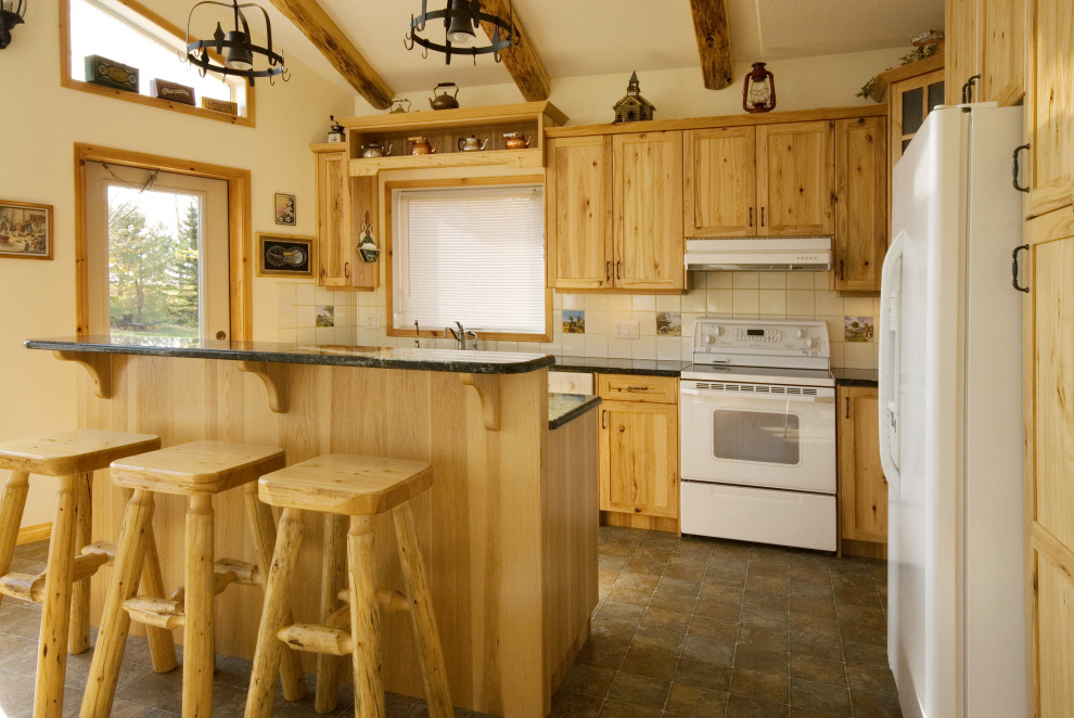 Example of a mountain style kitchen design in Calgary