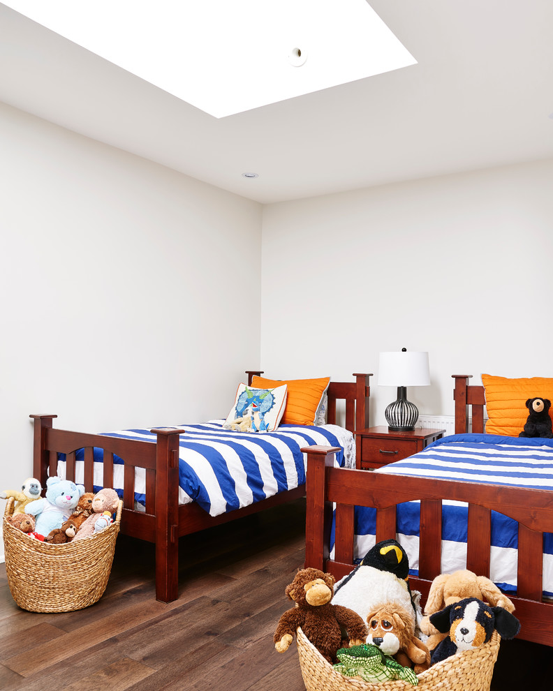 Design ideas for a mid-sized transitional guest bedroom in Toronto with blue walls and medium hardwood floors.