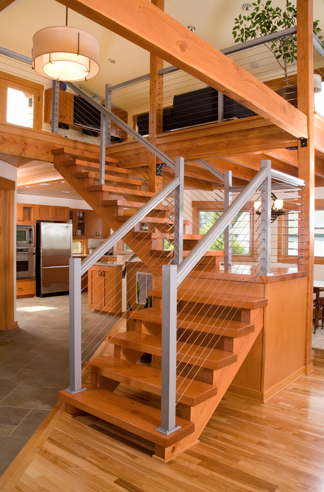 Contemporary wood l-shaped staircase in Seattle with wood risers.