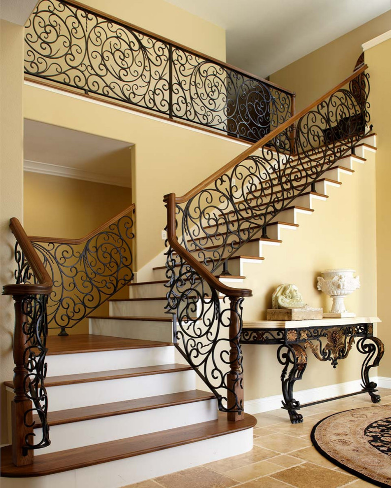Photo of a mid-sized traditional metal floating staircase in San Francisco with metal risers and metal railing.