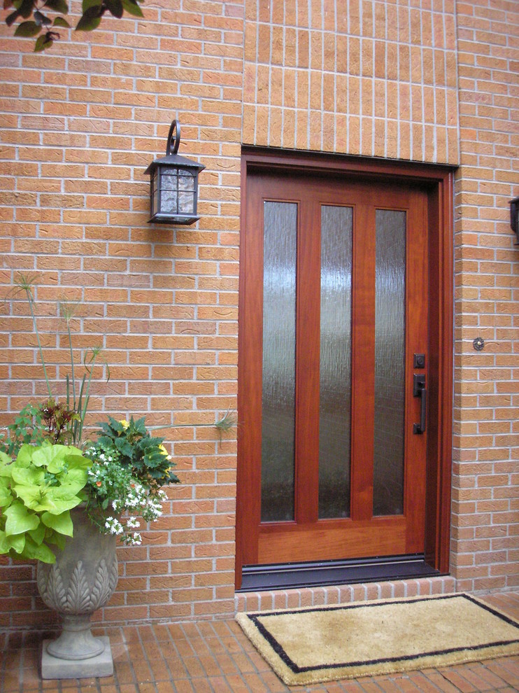 Inspiration for a mid-sized modern front door in Denver with red walls, a single front door and a medium wood front door.