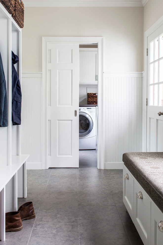 Inspiration for a mid-sized transitional mudroom in Boston with beige walls.