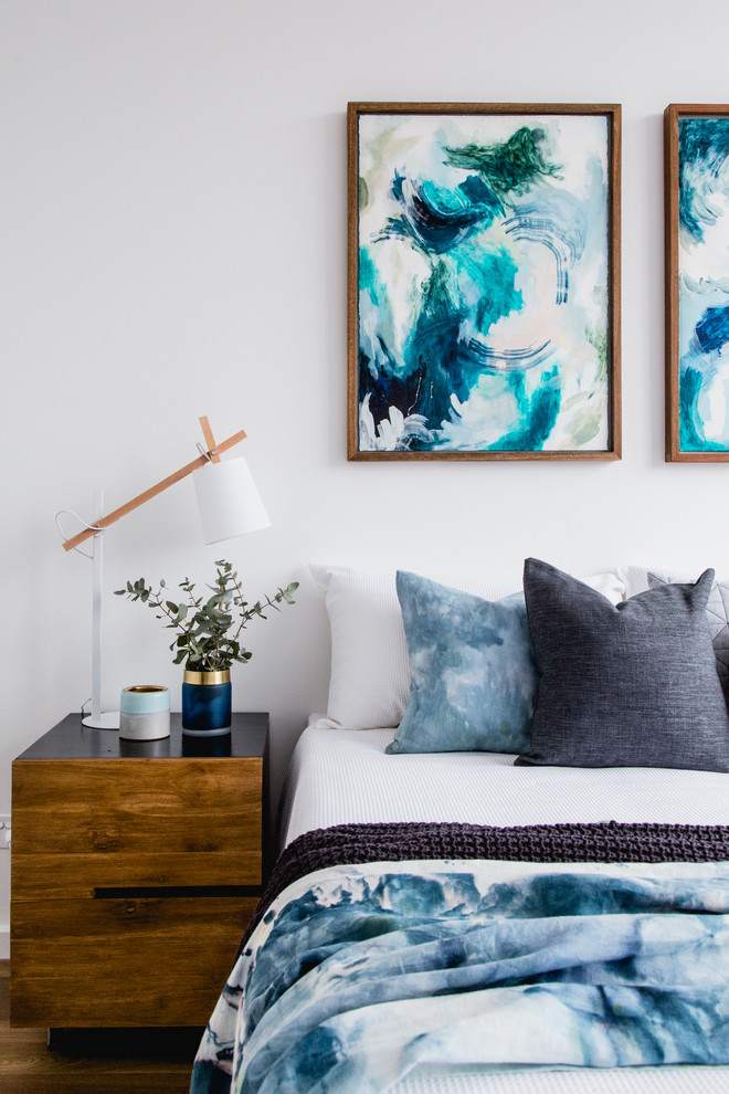 Mid-sized contemporary master bedroom in Melbourne with white walls, light hardwood floors and brown floor.