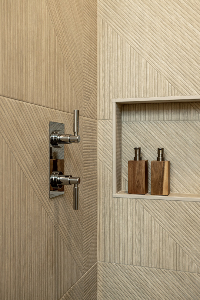 This is an example of a small world-inspired shower room bathroom in Los Angeles with flat-panel cabinets, medium wood cabinets, an alcove shower, a bidet, brown tiles, wood-effect tiles, beige walls, slate flooring, an integrated sink, solid surface worktops, black floors, a hinged door, white worktops, a wall niche, a single sink and a freestanding vanity unit.