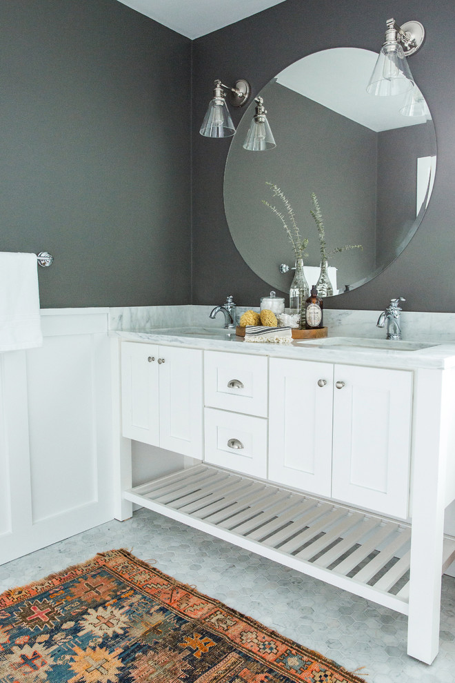 Design ideas for a mid-sized transitional master bathroom in Boston with shaker cabinets, white cabinets, a claw-foot tub, a corner shower, a two-piece toilet, white tile, subway tile, grey walls, marble floors, an undermount sink, marble benchtops, grey floor and a hinged shower door.