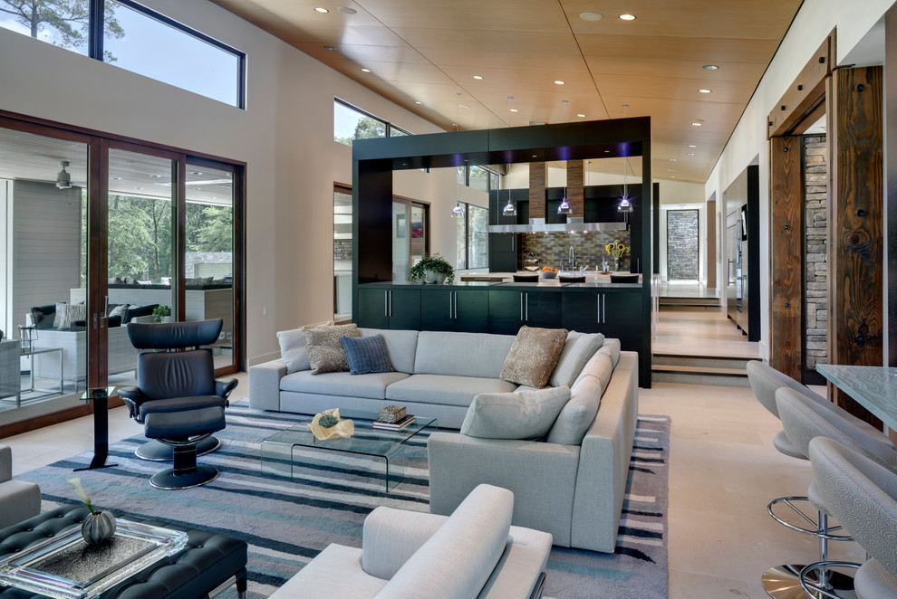 Contemporary open concept living room in Dallas with beige walls.