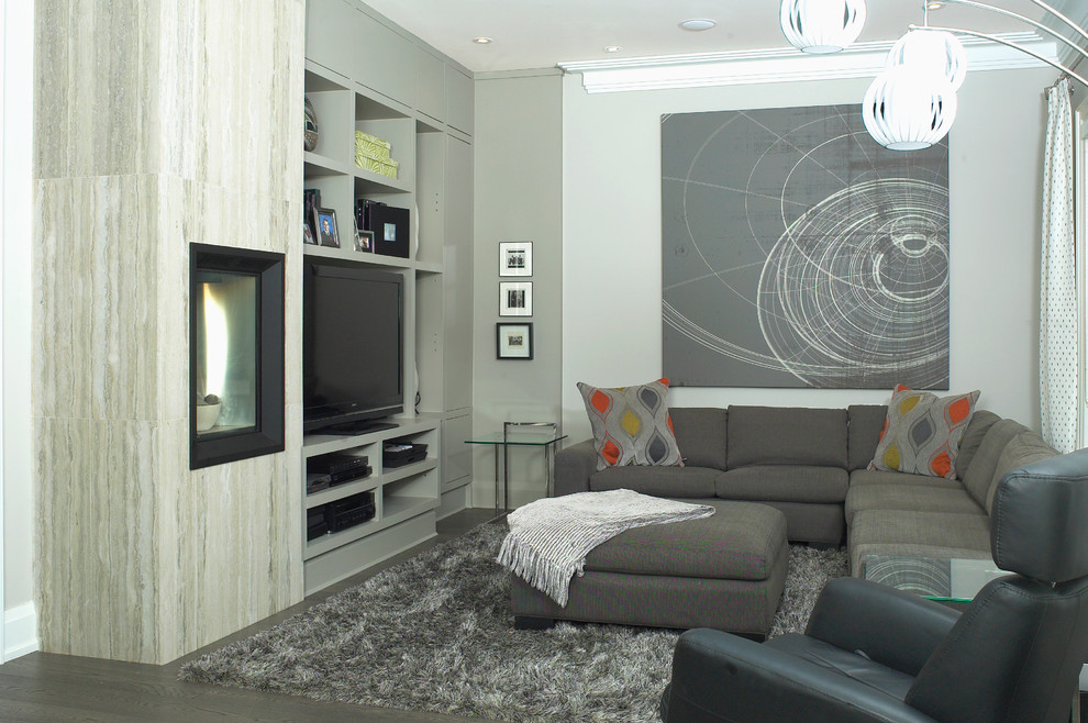 Mid-sized trendy open concept brown floor family room photo in Toronto with gray walls, a standard fireplace and a media wall