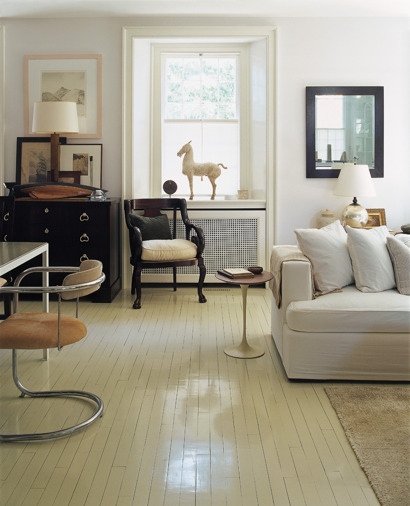 Traditional living room in New York with painted wood floors and white floor.