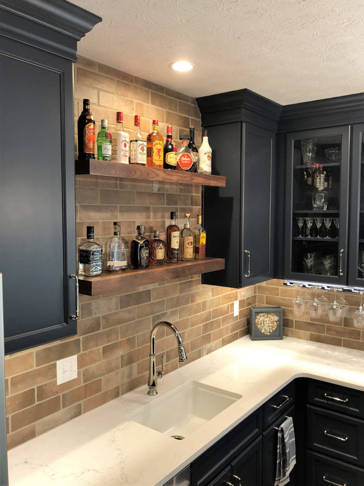 Design ideas for a medium sized traditional u-shaped wet bar in Other with a submerged sink, flat-panel cabinets, blue cabinets, engineered stone countertops, brown splashback, cement tile splashback, vinyl flooring, brown floors and white worktops.
