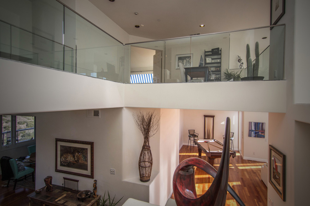 Example of a mid-sized minimalist freestanding desk medium tone wood floor home design design in Orange County with beige walls