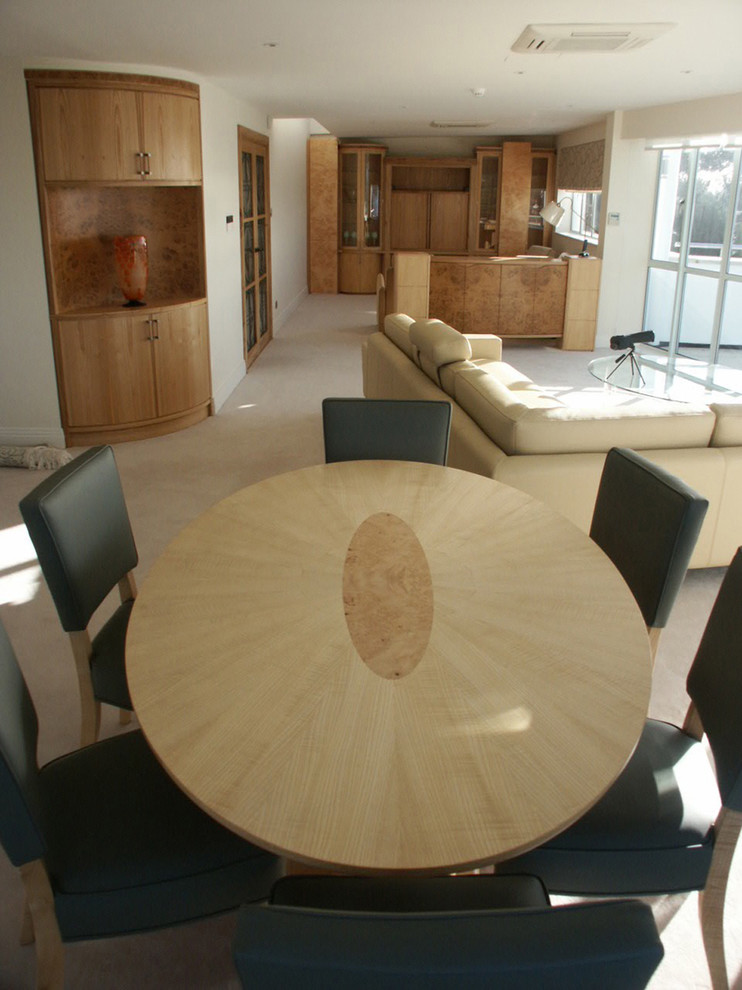 This is an example of a contemporary dining room in Dorset.