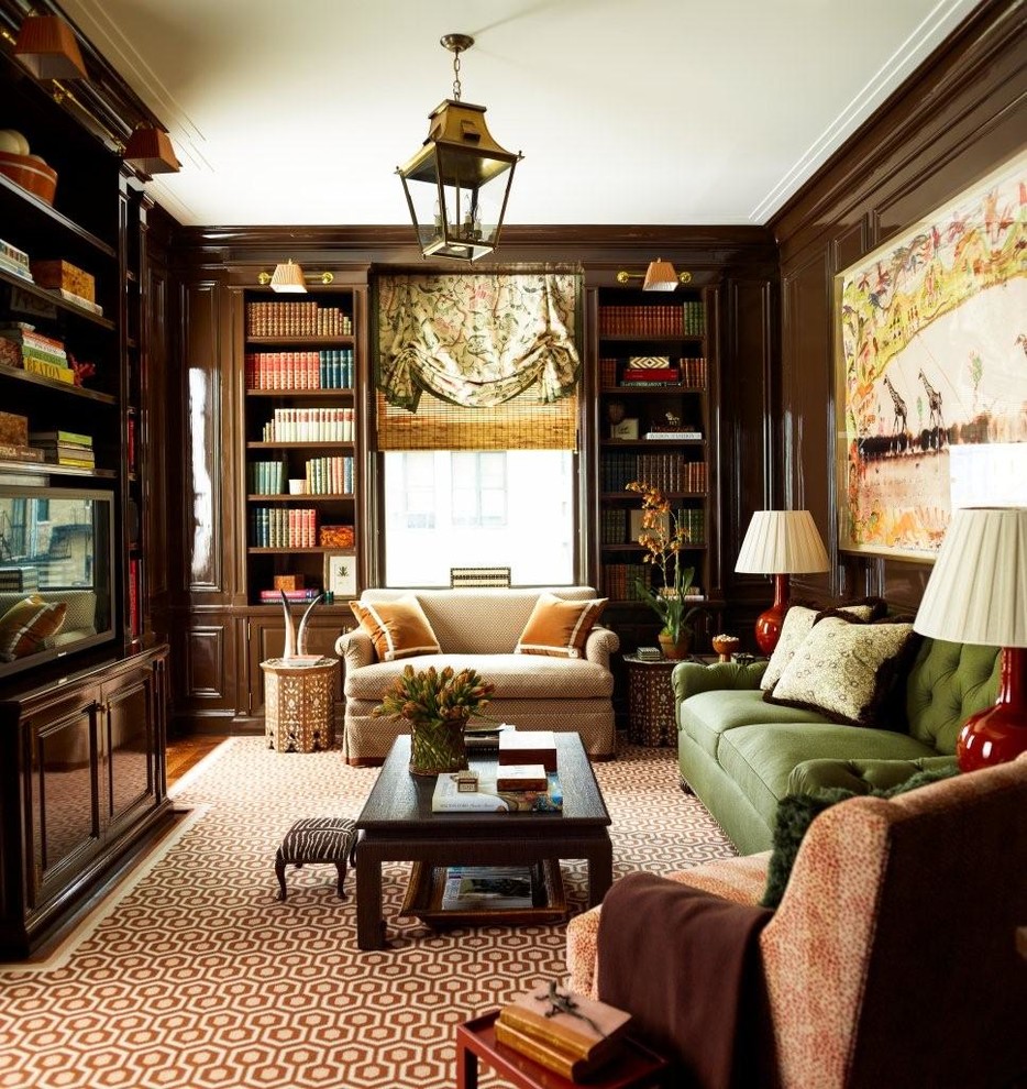 Traditional formal enclosed living room in New York with brown walls, medium hardwood floors and a built-in media wall.