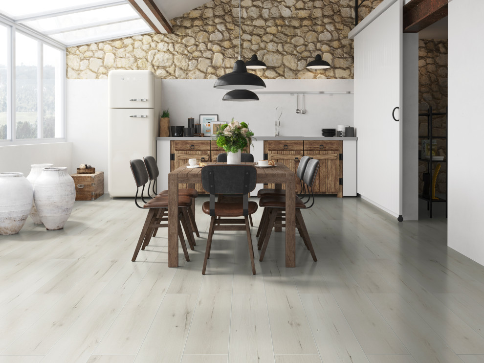 Inspiration for a dining room in Vancouver with laminate floors and white floors.