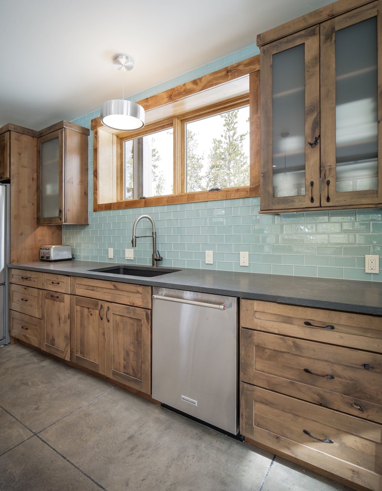 Eat-in kitchen - mid-sized rustic single-wall eat-in kitchen idea in Denver with an undermount sink, shaker cabinets, distressed cabinets, quartz countertops, blue backsplash, glass tile backsplash, stainless steel appliances, an island and gray countertops