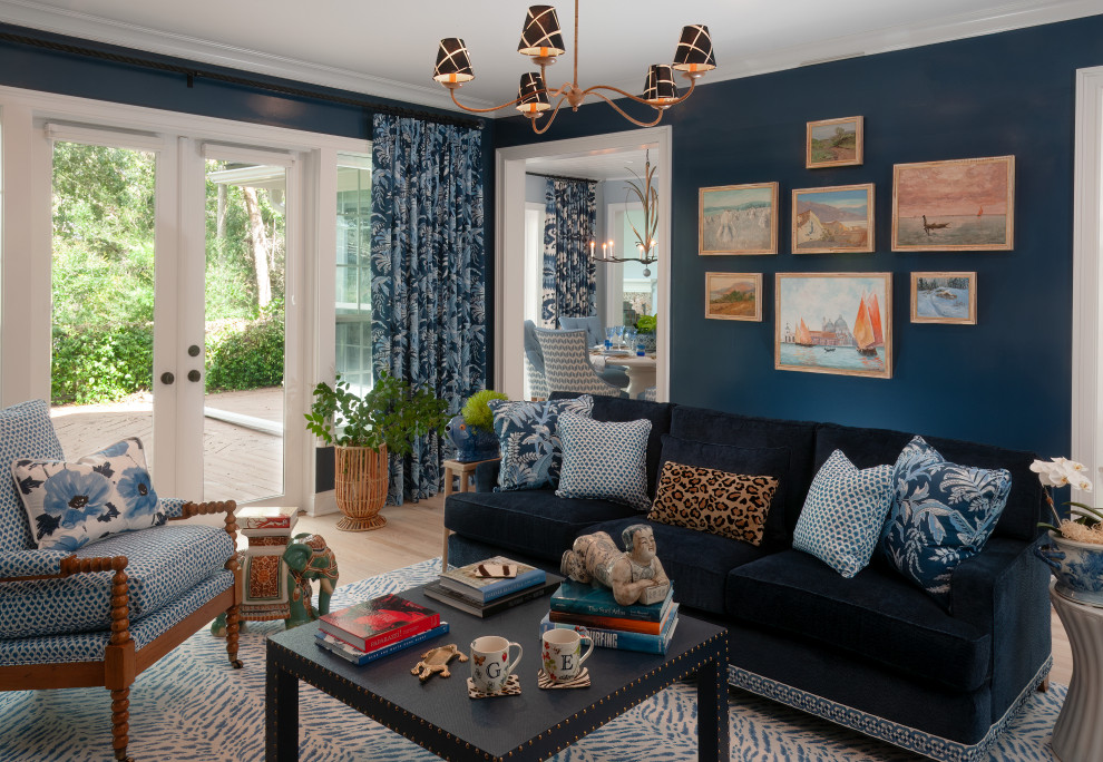 Inspiration for a transitional enclosed light wood floor and beige floor living room remodel in Jacksonville with blue walls