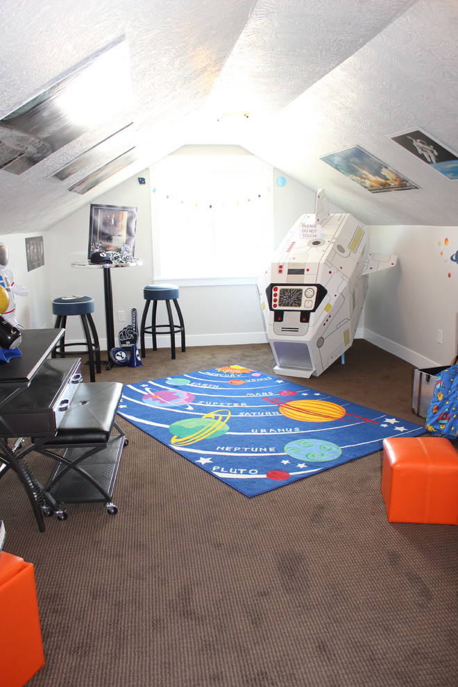 Large arts and crafts gender-neutral kids' playroom in Salt Lake City with grey walls and carpet.