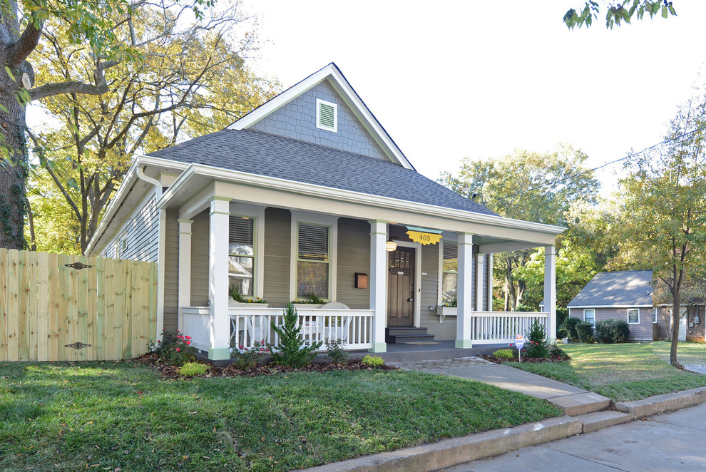 Inspiration for a small traditional one-storey grey house exterior in Atlanta with wood siding, a hip roof and a shingle roof.