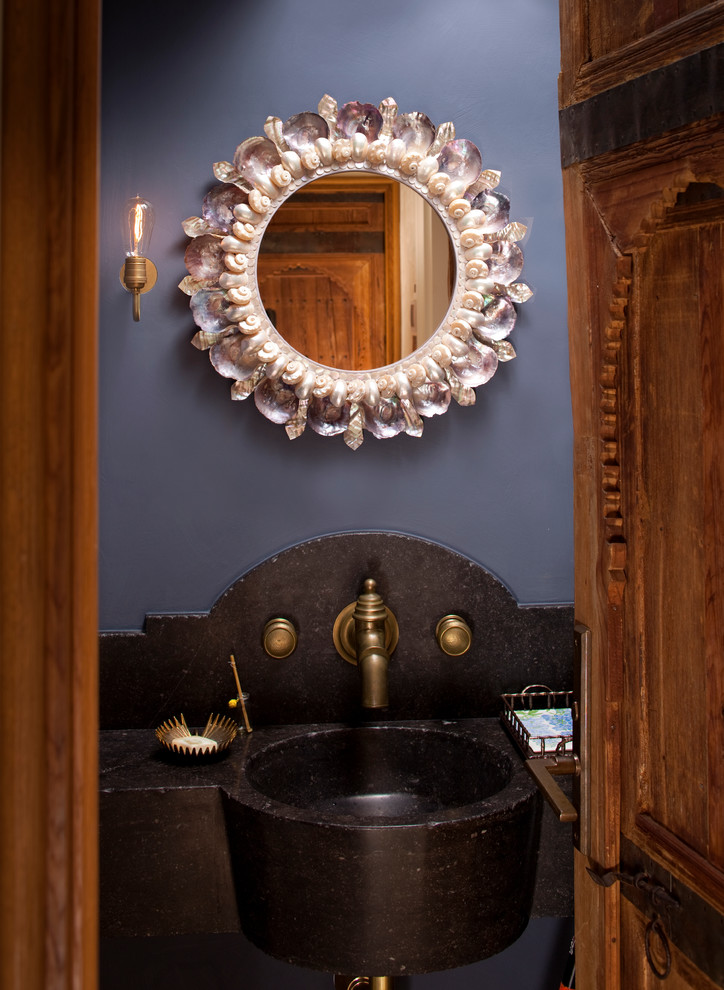 Inspiration for a mediterranean powder room in New York with an integrated sink.