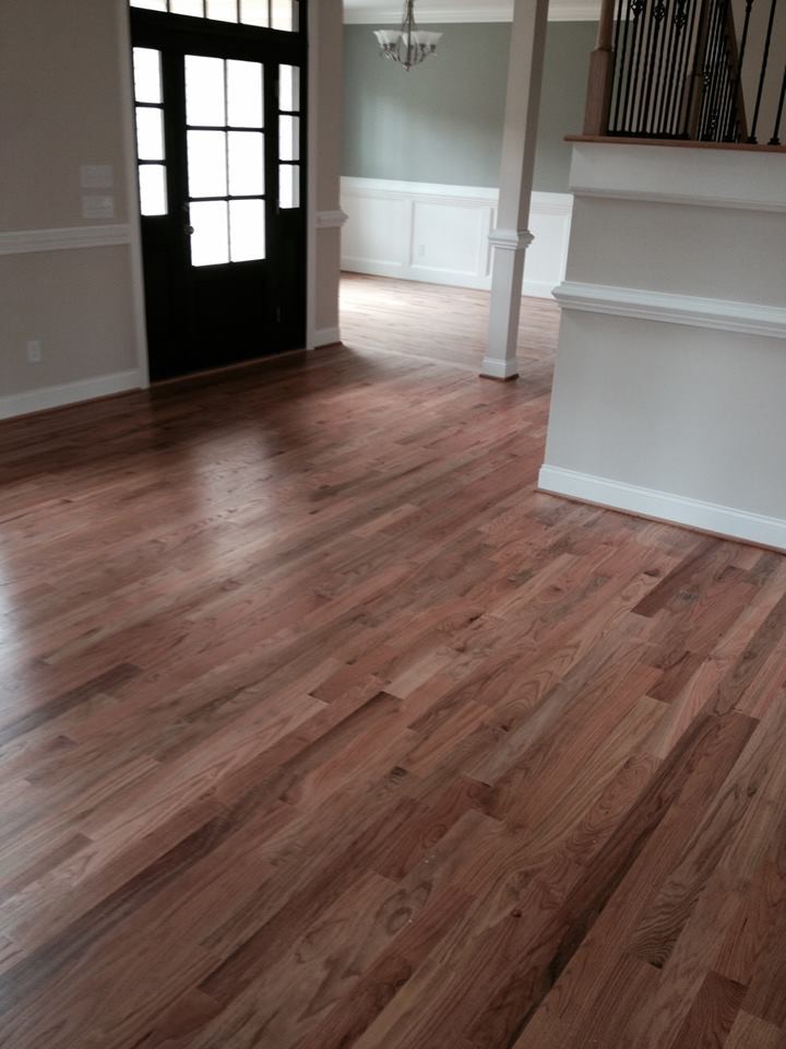 Inspiration for a transitional light wood floor single front door remodel in Raleigh with white walls