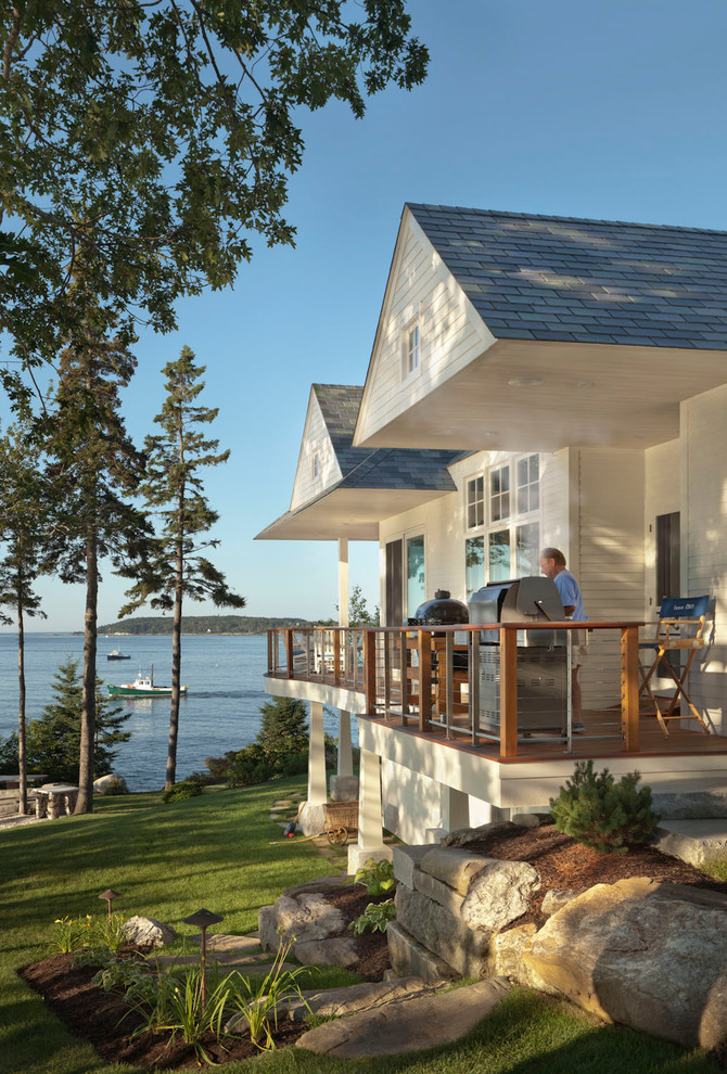 Design ideas for a transitional white exterior in Portland Maine with wood siding.