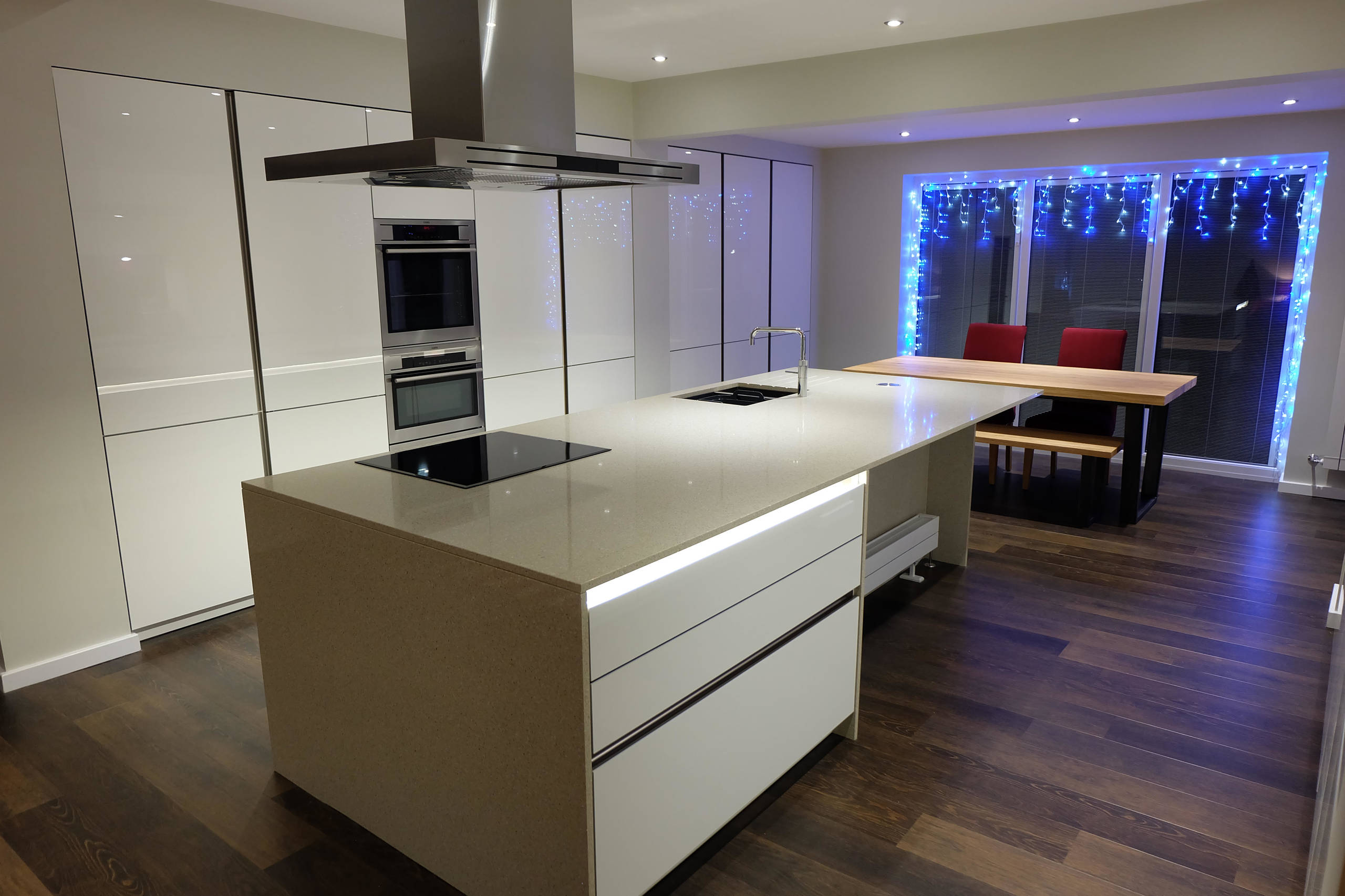 White Gloss Handleless Keller Kitchen with Brescia Stone Work Surfaces
